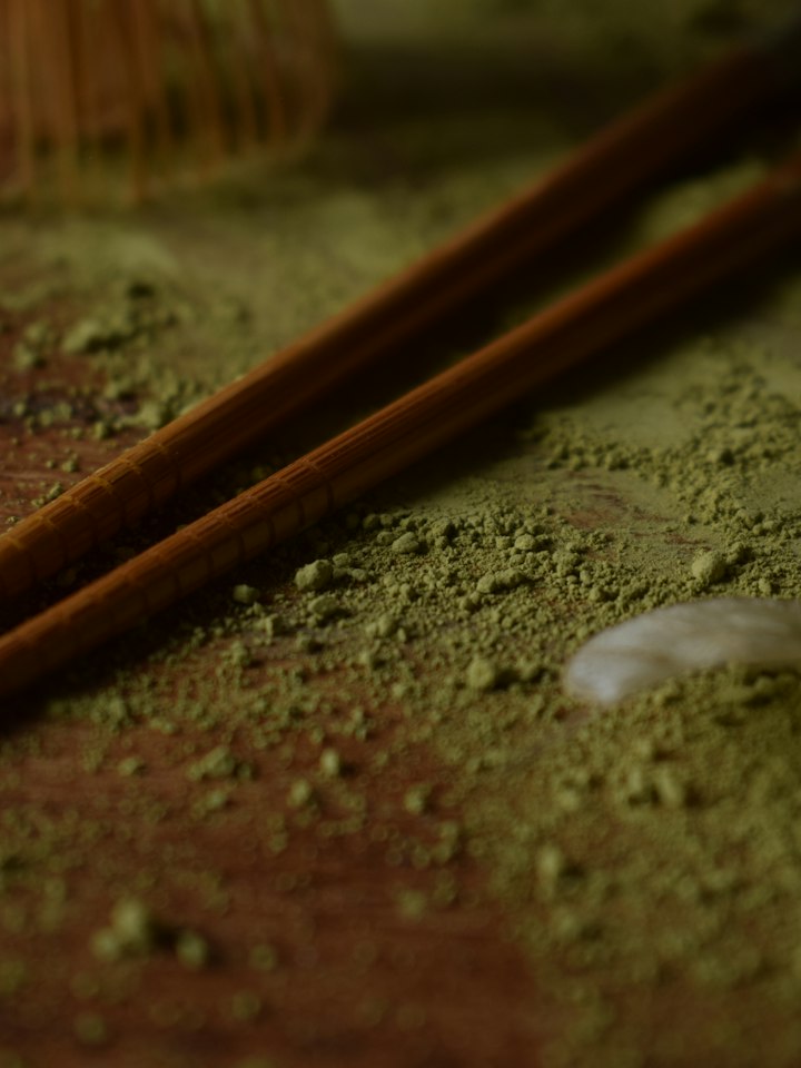 Stone-milled matcha powder with wooden chopsticks